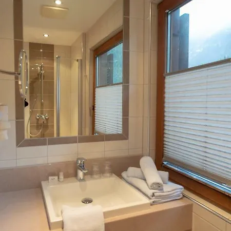Отель Alpenhotel Badmeister Флаттах